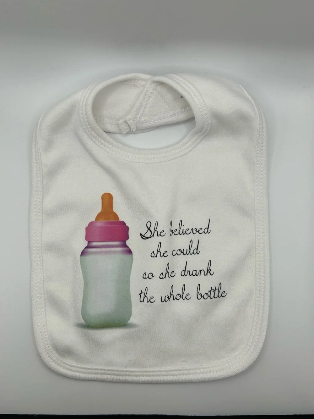 NWOT Cute White Baby Bib with Bottle Graphic and Quote